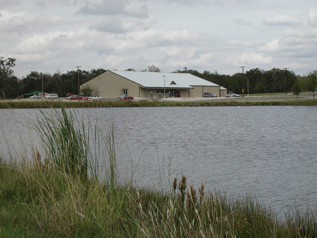 A view of the Emergency Operations Training Center building from across the lake.