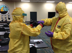 working while wearing hazmat suits