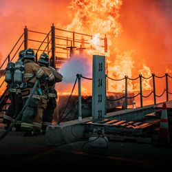 firefighter fighting a marine fire
