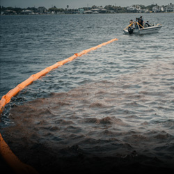 oil spill containment procedure in action