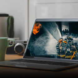 laptop screen with firefighting photo