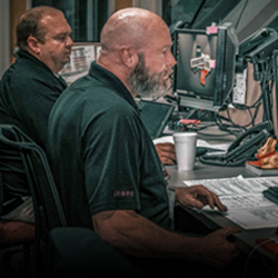 emergency coordinator at a computer