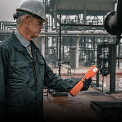 man in hard hat holding a sensor